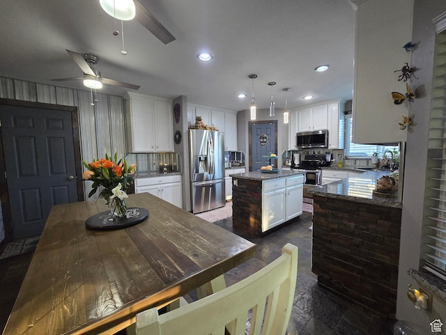 8894 S Sun Leaf Dr, West Jordan, UT 84088 - kitchen featuring stainless steel appliances, a center island, a ceiling fan, white cabinets, and recessed lighting