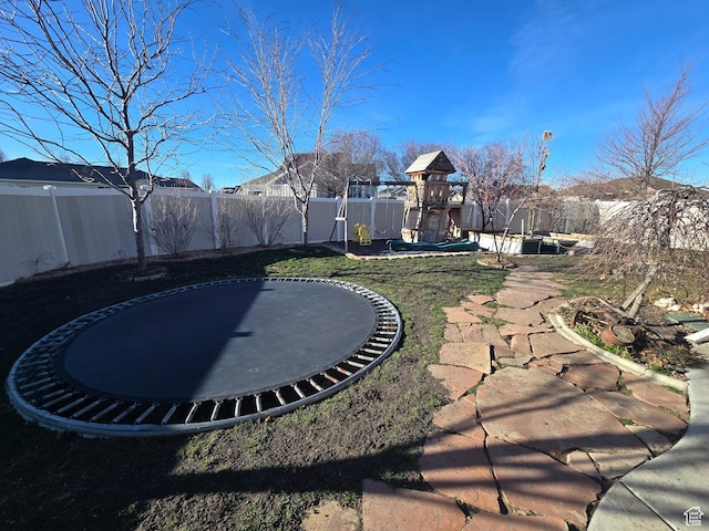 8894 S Sun Leaf Dr, West Jordan, UT 84088 - fenced backyard with a trampoline and a playground