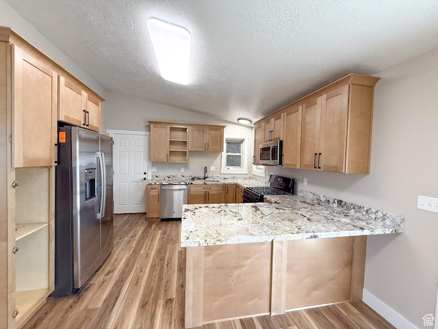 510 W Highway Dr, Wellington, UT 84542 - kitchen featuring light wood-style flooring, a peninsula, appliances with stainless steel finishes, light brown cabinets, and open shelves