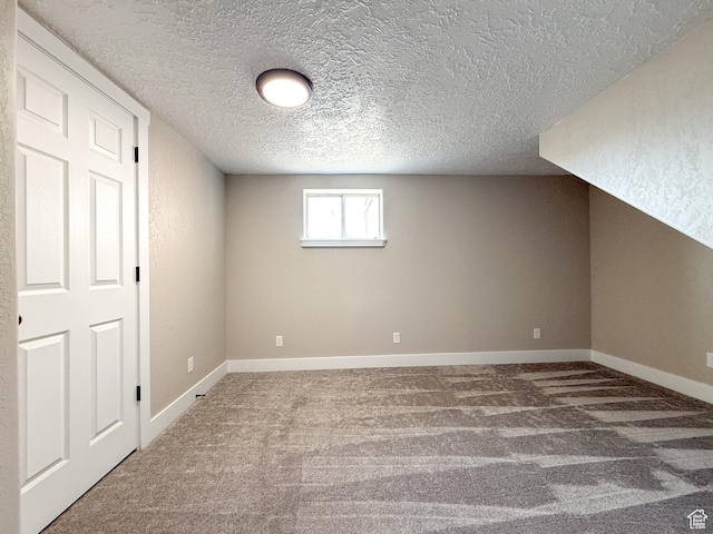 510 W Highway Dr, Wellington, UT 84542 - bonus room featuring carpet flooring, baseboards, and a textured ceiling