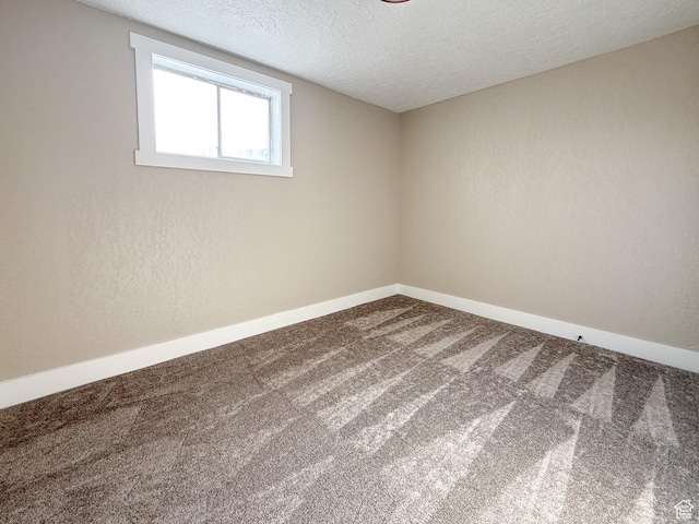 510 W Highway Dr, Wellington, UT 84542 - carpeted empty room featuring a textured wall, baseboards, and a textured ceiling