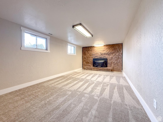 510 W Highway Dr, Wellington, UT 84542 - below grade area featuring baseboards, carpet flooring, a textured ceiling, and a textured wall