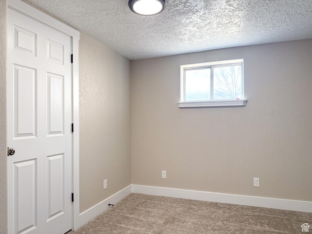 510 W Highway Dr, Wellington, UT 84542 - carpeted spare room featuring baseboards and a textured ceiling
