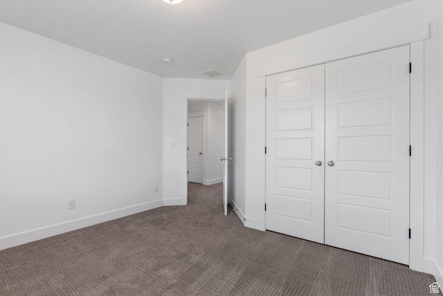 951 W Cushing Rd, Bluffdale, UT 84065 - unfurnished bedroom featuring baseboards, dark carpet, and a closet
