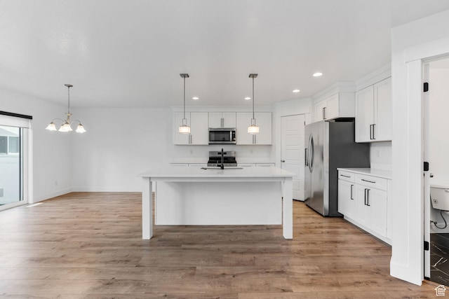 951 W Cushing Rd, Bluffdale, UT 84065 - kitchen with white cabinetry, light countertops, light wood-style flooring, and appliances with stainless steel finishes