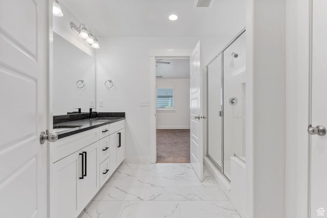 951 W Cushing Rd, Bluffdale, UT 84065 - full bathroom featuring baseboards, marble finish floor, double vanity, a sink, and a stall shower