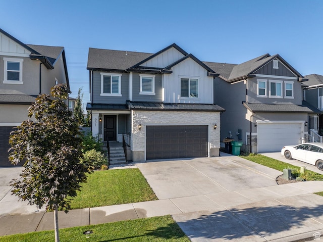 951 W Cushing Rd, Bluffdale, UT 84065 - view of front facade with an attached garage, a standing seam roof, board and batten siding, and concrete driveway
