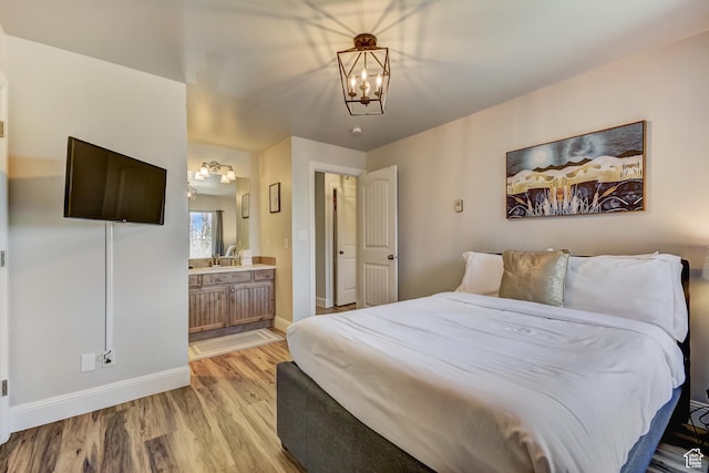 1637 Village Round Dr Unit 8, Park City, UT 84098 - bedroom with baseboards, a notable chandelier, light wood-style flooring, and ensuite bathroom