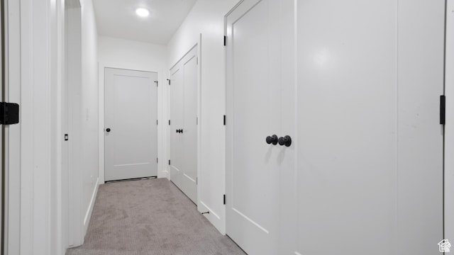 hallway with carpet
