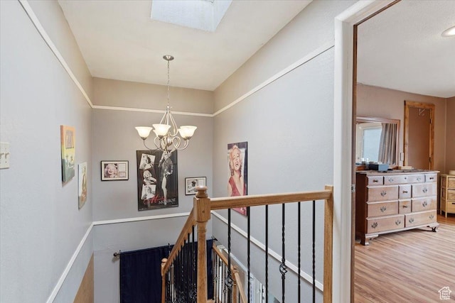 613 N 100 E, Brigham City, UT 84302 - stairway with wood finished floors, an inviting chandelier, and a skylight