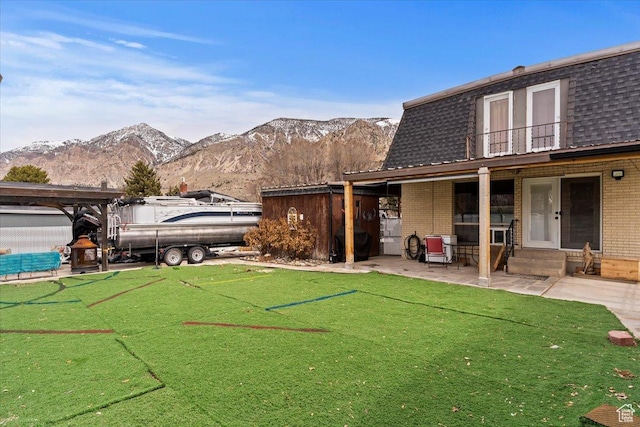 613 N 100 E, Brigham City, UT 84302 - view of yard with a mountain view and a patio area