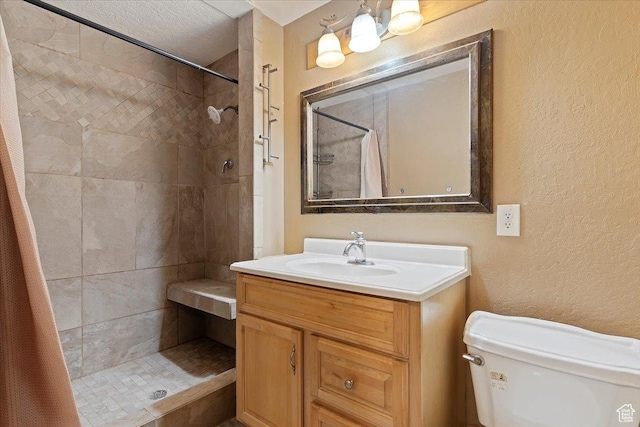 613 N 100 E, Brigham City, UT 84302 - full bathroom featuring a textured wall, a tile shower, toilet, and vanity