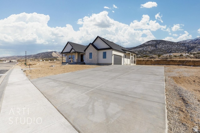 1283 S 500 W Unit 10, Manti, UT 84642 - view of front of home featuring an attached garage, a mountain view, and concrete driveway