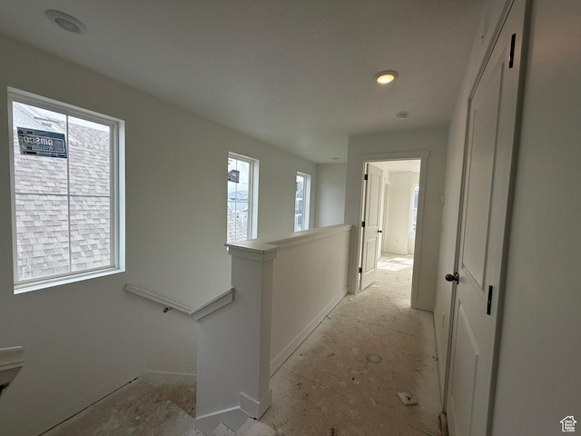 corridor featuring an upstairs landing