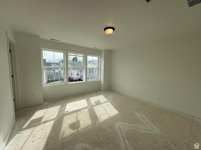spare room with visible vents