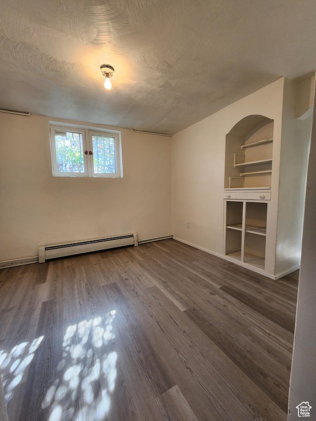 383 S 100 W, Price, UT 84501 - empty room with a baseboard heating unit and wood finished floors