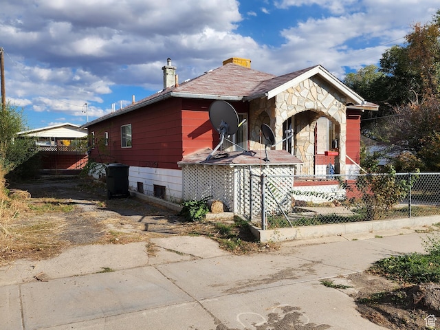 383 S 100 W, Price, UT 84501 - view of property exterior with a chimney and stone siding
