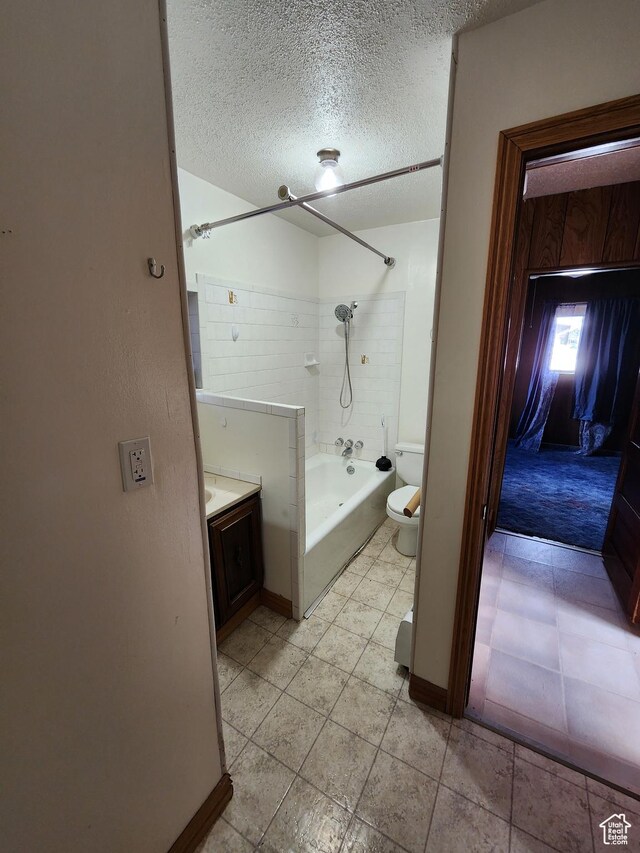 383 S 100 W, Price, UT 84501 - full bathroom featuring a textured ceiling, toilet, bathtub / shower combination, vanity, and baseboards