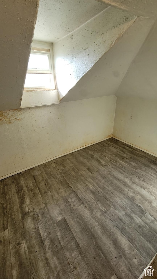 390 S 400 W, Logan, UT 84321 - additional living space with lofted ceiling and dark wood-style floors