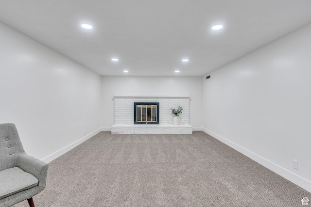 3981 S Kewanee Dr, West Valley City, UT 84120 - unfurnished living room with baseboards, a fireplace, recessed lighting, and carpet flooring