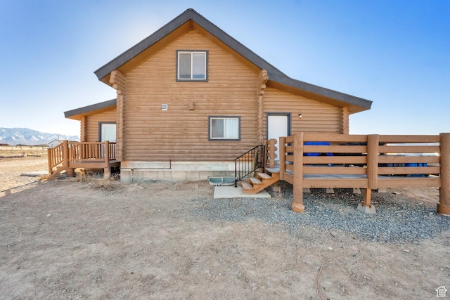 183 N Silver Sage Rd, Vernon, UT 84080 - rear view of house with log siding and a deck with mountain view