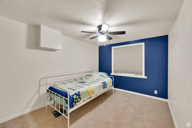 183 N Silver Sage Rd, Vernon, UT 84080 - carpeted bedroom with baseboards, a textured ceiling, and a ceiling fan
