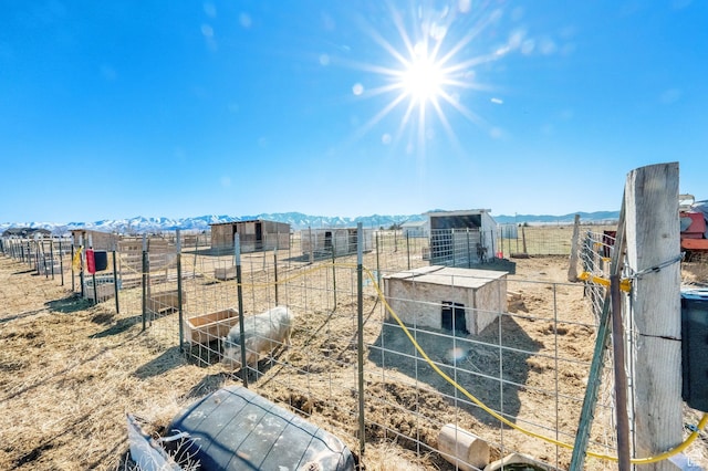 183 N Silver Sage Rd, Vernon, UT 84080 - view of yard with a rural view, an outbuilding, a mountain view, and fence
