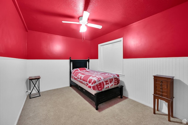 183 N Silver Sage Rd, Vernon, UT 84080 - carpeted bedroom with a textured ceiling, ceiling fan, and wainscoting