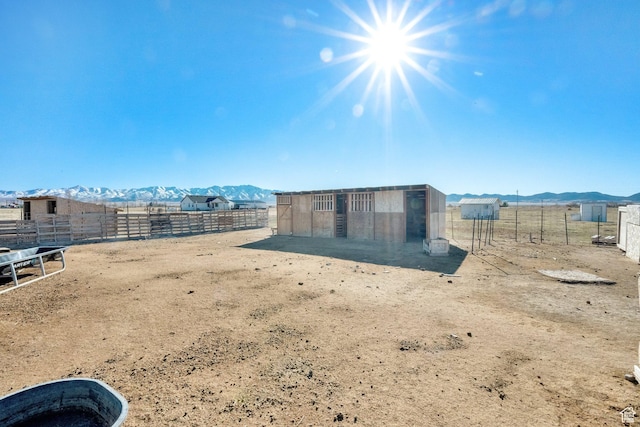 183 N Silver Sage Rd, Vernon, UT 84080 - view of yard featuring an enclosed area, an exterior structure, an outbuilding, and a mountain view