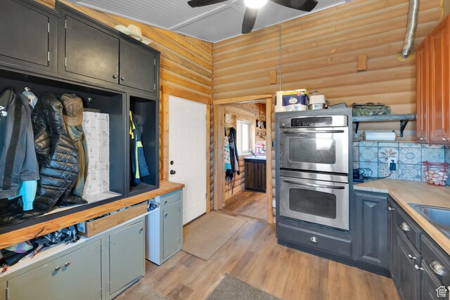 183 N Silver Sage Rd, Vernon, UT 84080 - kitchen featuring light countertops, light wood finished floors, stainless steel double oven, ceiling fan, and open shelves