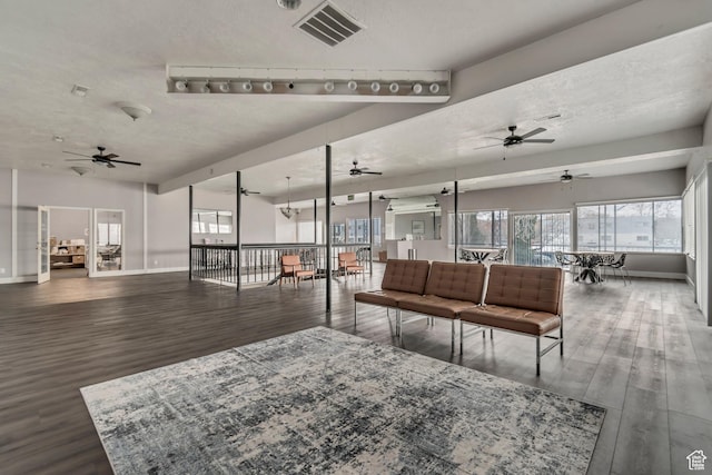 742 S 400 E Unit H102, Salt Lake City, UT 84111 - living area with a ceiling fan, wood finished floors, a textured ceiling, and visible vents