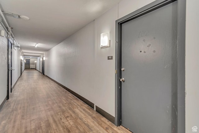 742 S 400 E Unit H102, Salt Lake City, UT 84111 - corridor featuring light wood finished floors and baseboards