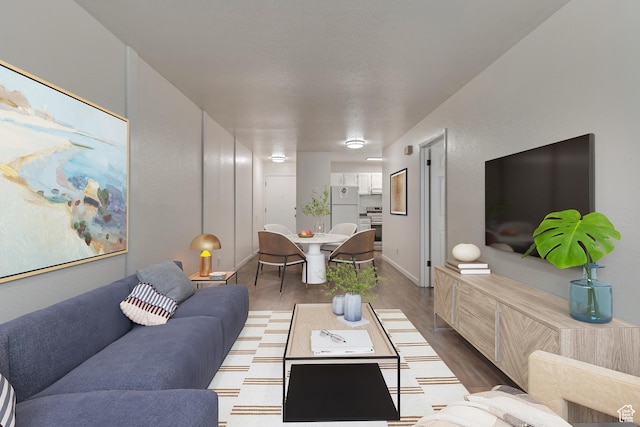 living room featuring baseboards and wood finished floors