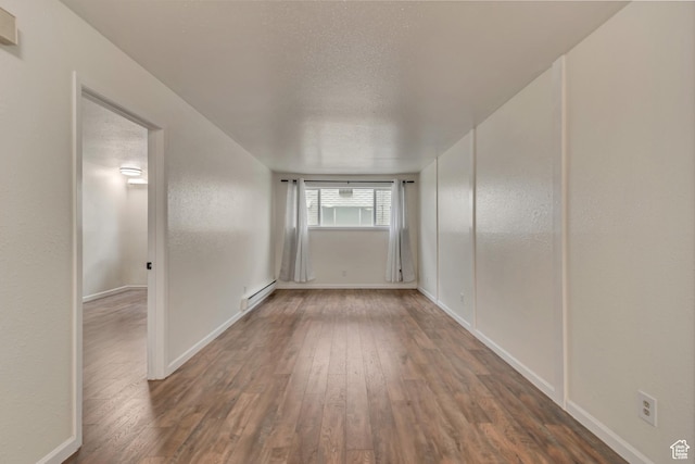 742 S 400 E Unit H102, Salt Lake City, UT 84111 - empty room with baseboards, a textured ceiling, and wood finished floors