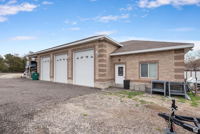12381 S 3600 W, Riverton, UT 84065 - view of front facade with a shingled roof and brick siding
