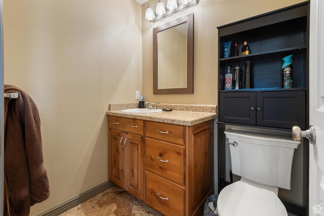 12381 S 3600 W, Riverton, UT 84065 - bathroom featuring toilet, vanity, and baseboards