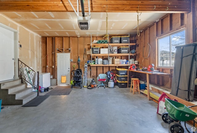 garage featuring a workshop area and a garage door opener