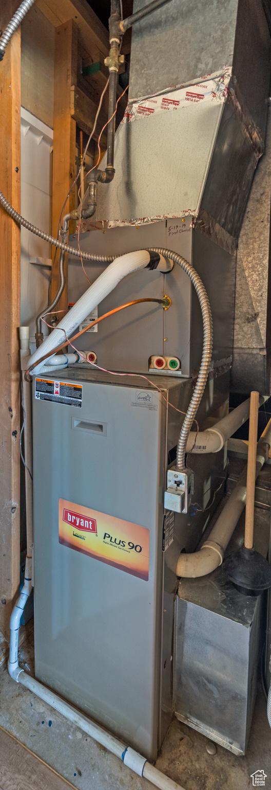 utility room with heating unit