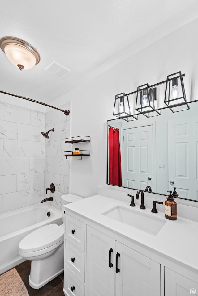 full bath featuring toilet, vanity, tub / shower combination, and visible vents