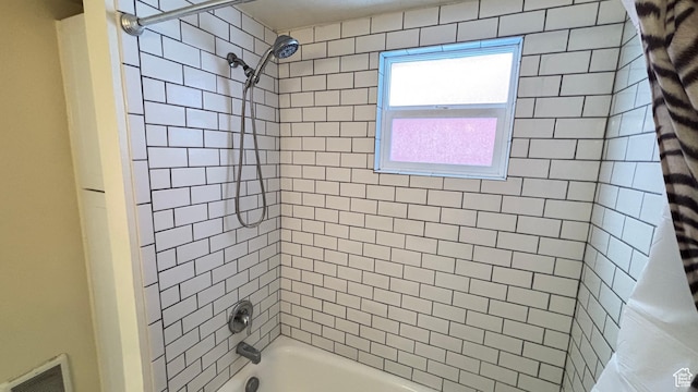 full bath featuring shower / tub combo with curtain and visible vents