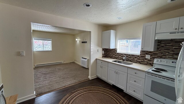 kitchen featuring white range with electric cooktop, a sink, a baseboard heating unit, light countertops, and under cabinet range hood