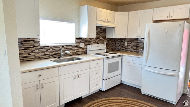 kitchen featuring a sink, white appliances, light countertops, white cabinets, and under cabinet range hood
