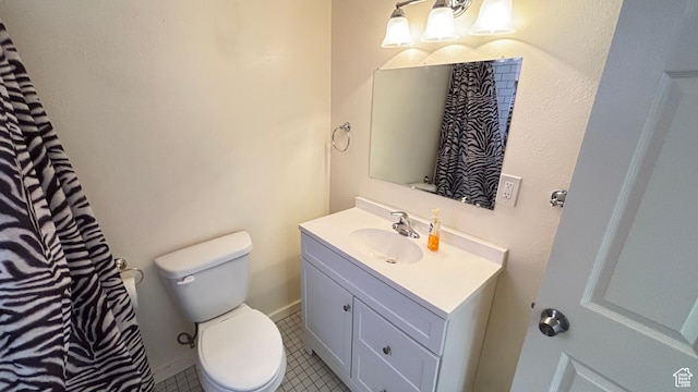 full bath with vanity, tile patterned flooring, and toilet