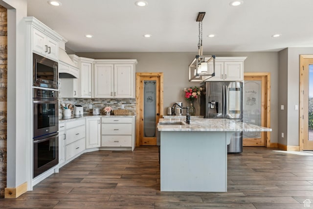 1101 E Stage Coach Run N, Morgan, UT 84050 - kitchen with a sink, tasteful backsplash, light stone countertops, dark wood-style floors, and stainless steel appliances