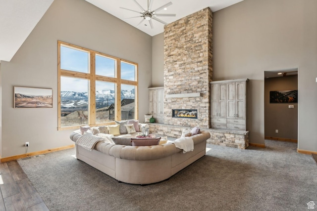 1101 E Stage Coach Run N, Morgan, UT 84050 - living area with a fireplace, a high ceiling, wood finished floors, baseboards, and ceiling fan