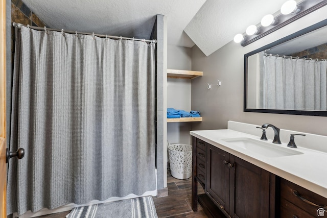 1101 E Stage Coach Run N, Morgan, UT 84050 - bathroom with a shower with curtain, wood finished floors, vanity, and a textured ceiling