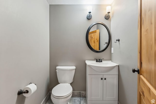 1101 E Stage Coach Run N, Morgan, UT 84050 - bathroom with baseboards, toilet, and vanity