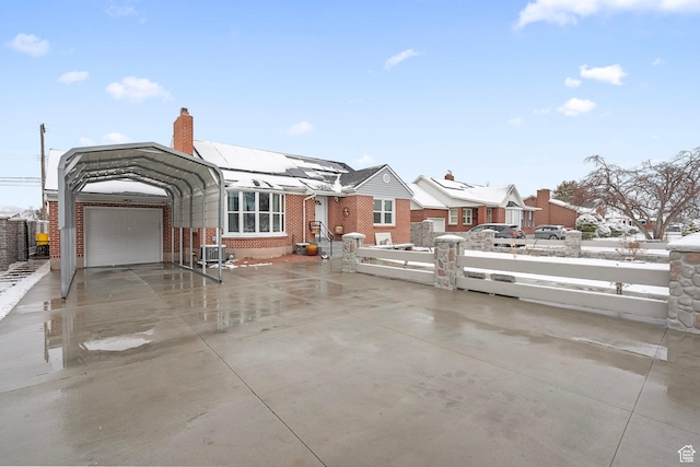319 N 800 W, Orem, UT 84057 - exterior space featuring driveway, brick siding, a fenced front yard, and a chimney
