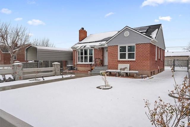 319 N 800 W, Orem, UT 84057 - view of front of home with brick siding, fence, and a chimney