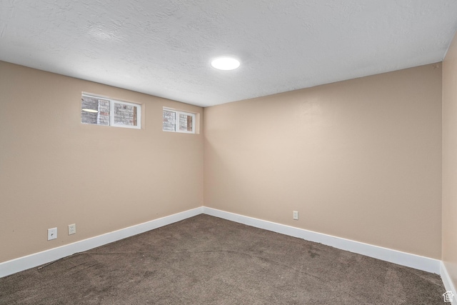 319 N 800 W, Orem, UT 84057 - empty room with baseboards, a textured ceiling, and dark carpet